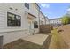 Townhome's backyard featuring patio area, wood fencing, and lush green lawn space at 3546 Sorrel Ln, Duluth, GA 30096