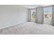 Comfortable bedroom with soft carpet, windows with drapes, and plenty of natural light at 3546 Sorrel Ln, Duluth, GA 30096