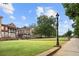 Beautifully landscaped community green with well-maintained lawns, sidewalks, and mature trees, creating a serene environment at 3546 Sorrel Ln, Duluth, GA 30096