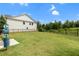 Community dog park with well-maintained grass, dog waste station, and secure fencing at 3546 Sorrel Ln, Duluth, GA 30096