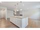 Spacious kitchen island with granite countertop, offering ample seating and workspace at 3546 Sorrel Ln, Duluth, GA 30096