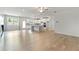 Open-concept living space with hardwood floors, a fireplace, and abundant natural light at 3546 Sorrel Ln, Duluth, GA 30096