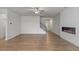 Spacious living area showcasing hardwood floors, a staircase, and a modern fireplace at 3546 Sorrel Ln, Duluth, GA 30096