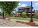 Modern two-story restaurant with outdoor seating and a brick pathway leading to a grassy area at 3546 Sorrel Ln, Duluth, GA 30096