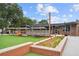 Exterior view of Truck & Tap with outdoor seating, picnic tables, and a well-manicured lawn area at 3546 Sorrel Ln, Duluth, GA 30096