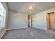 This spacious bedroom features plush carpeting and a walk-in closet at 3557 Bryant Meadows Cir, Buford, GA 30519