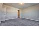 Bright bedroom featuring neutral paint, modern light fixture and a walk-in closet at 3557 Bryant Meadows Cir, Buford, GA 30519