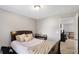 Guest bedroom featuring neutral walls, carpet, and a view to the hallway at 7628 Summer Berry Ln, Lithonia, GA 30038