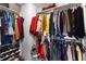 Walk-in closet with clothing racks, shelving, and ample storage space at 7628 Summer Berry Ln, Lithonia, GA 30038