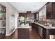 Well-appointed kitchen with an island, stainless steel appliances, and dark wood cabinetry at 7628 Summer Berry Ln, Lithonia, GA 30038