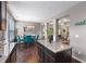 Open-concept kitchen and dining area features hardwood floors and granite countertops at 7628 Summer Berry Ln, Lithonia, GA 30038