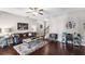 Inviting living room showcasing hardwood floors, a stylish sofa, and an open concept design at 7628 Summer Berry Ln, Lithonia, GA 30038