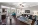 Bright living room featuring hardwood floors, stylish furniture, and an open layout at 7628 Summer Berry Ln, Lithonia, GA 30038