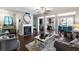 Spacious living room with a fireplace, open floor plan, and modern decor at 7628 Summer Berry Ln, Lithonia, GA 30038
