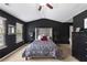 Elegant main bedroom features vaulted ceilings, a large bed, and dark accents at 7628 Summer Berry Ln, Lithonia, GA 30038