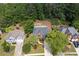 Aerial view of a home with mature trees and landscaping in a residential neighborhood at 809 Hillcrest Ln, Woodstock, GA 30189