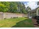 Spacious backyard features a well-manicured lawn and patio seating at 809 Hillcrest Ln, Woodstock, GA 30189