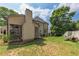 Spacious backyard featuring a screened-in porch and patio seating at 809 Hillcrest Ln, Woodstock, GA 30189