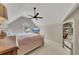 Tranquil bedroom under a sloped ceiling with natural lighting and a view of the outdoors at 809 Hillcrest Ln, Woodstock, GA 30189