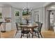 Eat-in kitchen breakfast nook with hardwood floors, natural light, and views of the backyard at 809 Hillcrest Ln, Woodstock, GA 30189