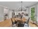 Bright dining area with a round table and chairs adjacent to the modern, updated kitchen at 809 Hillcrest Ln, Woodstock, GA 30189