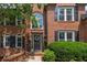 Beautiful brick home with black shutters, arched windows, and an inviting front entryway at 809 Hillcrest Ln, Woodstock, GA 30189