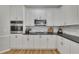 Kitchen with stainless steel appliances, granite counters, and white cabinets at 809 Hillcrest Ln, Woodstock, GA 30189