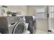 Functional laundry room with a modern washer and dryer, and space-saving storage solutions at 809 Hillcrest Ln, Woodstock, GA 30189