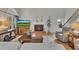 Inviting living room featuring a cozy fireplace and comfortable seating area with hardwood floors at 809 Hillcrest Ln, Woodstock, GA 30189