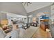 Spacious open-concept living room with hardwood floors that connects to the dining area and kitchen at 809 Hillcrest Ln, Woodstock, GA 30189