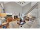 Beautiful living room with a brick fireplace, high ceilings, and staircase at 809 Hillcrest Ln, Woodstock, GA 30189
