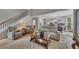 Cozy living room with comfortable seating, hardwood floors, and staircase at 809 Hillcrest Ln, Woodstock, GA 30189