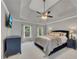 Relaxing main bedroom showcasing a tray ceiling, ceiling fan, and large bed at 809 Hillcrest Ln, Woodstock, GA 30189