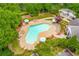 Aerial view of community pool with ample lounge chairs and umbrellas, perfect for relaxation at 809 Hillcrest Ln, Woodstock, GA 30189