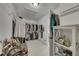 Organized walk-in closet with ample storage racks and shelving for clothes and accessories at 809 Hillcrest Ln, Woodstock, GA 30189
