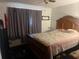 Cozy bedroom with a large bed, soft lighting, and a window, creating a relaxing atmosphere at 10199 Starr Sw St, Covington, GA 30014