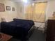 Comfortable bedroom featuring a plush bed, window, and room for storage, providing a serene retreat at 10199 Starr Sw St, Covington, GA 30014