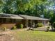 Charming brick home with mature trees and a well-manicured front yard, perfect for curb appeal at 10199 Starr Sw St, Covington, GA 30014