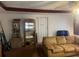 Comfortable living room showcasing a couch and display cabinets with natural light at 10199 Starr Sw St, Covington, GA 30014