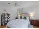 Bright bedroom featuring a ceiling fan, neutral walls, and an upholstered headboard at 1879 Johnson Ne Rd # 10, Atlanta, GA 30306