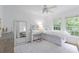 Bright bedroom featuring large windows, hardwood floors, and a dedicated study area at 1879 Johnson Ne Rd # 10, Atlanta, GA 30306