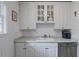 Charming kitchen with white cabinets, stainless steel dishwasher, and ample counter space for meal prep at 1879 Johnson Ne Rd # 10, Atlanta, GA 30306