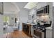 Modern kitchen with stainless steel appliances, a breakfast bar, and open layout to the living area at 1879 Johnson Ne Rd # 10, Atlanta, GA 30306