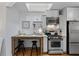 Bright kitchen featuring a skylight, stainless steel appliances, and breakfast bar for a cozy dining space at 1879 Johnson Ne Rd # 10, Atlanta, GA 30306