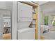 Convenient laundry closet with stacked washer and dryer, leading to a bright, inviting bedroom at 1879 Johnson Ne Rd # 10, Atlanta, GA 30306