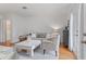 Bright living room with hardwood floors, neutral furniture, a white coffee table, and French doors leading to outdoor space at 1879 Johnson Ne Rd # 10, Atlanta, GA 30306