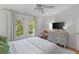 Inviting main bedroom with bright windows, hardwood floors, and a stylish dresser for a comfortable retreat at 1879 Johnson Ne Rd # 10, Atlanta, GA 30306