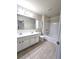 Large bathroom featuring double sinks, a toilet, and a shower-tub combination at 2104 Meadow Peak Rd, Duluth, GA 30097