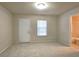 Bright, carpeted bedroom with natural light and an attached bathroom at 2104 Meadow Peak Rd, Duluth, GA 30097