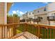 View from wooden deck overlooking the lawn, with a view of neighboring units at 2104 Meadow Peak Rd, Duluth, GA 30097